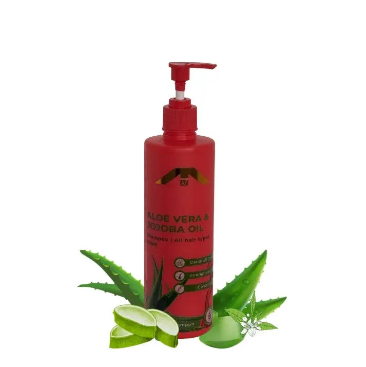 “All People Aloe Vera & Jojoba Oil Shampoo bottle with pump, standing with aloe vera slices and jojoba flower on a clean white background.”