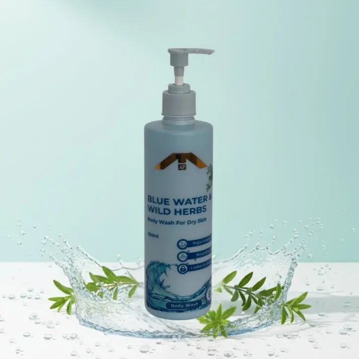 “All People Blue Water & Wild Herbs Body Wash bottle with pump, placed inside a rising water splash with green herbal leaves on a pale aqua background.”
