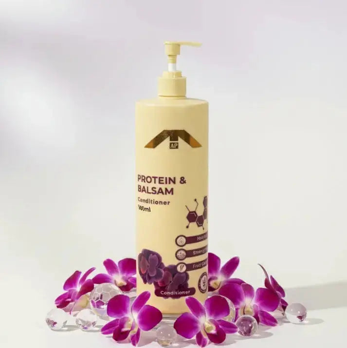 All People Protein & Balsam Conditioner bottle with pump, shown front-facing surrounded by purple orchids on a clean white background.