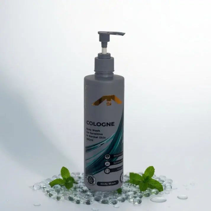 “All People Cologne Body Wash bottle with pump, standing on clear gel beads with mint leaves on a bright white backdrop.”