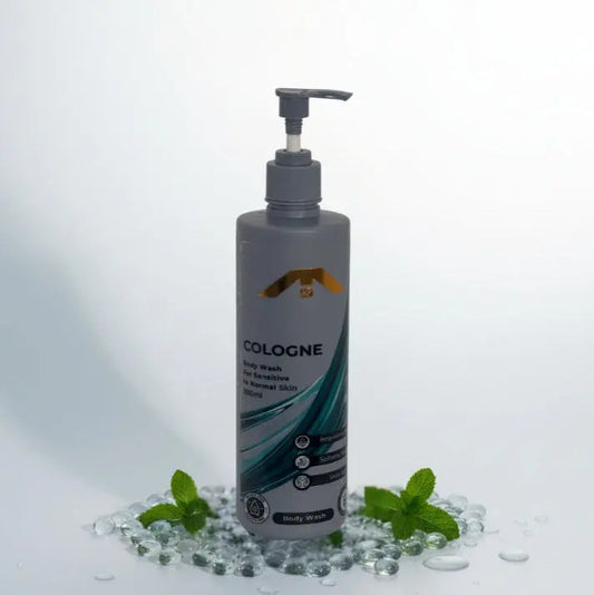 “All People Cologne Body Wash bottle with pump, standing on clear gel beads with mint leaves on a bright white backdrop.”