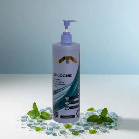 All People Cologne Shampoo bottle with pump, displayed front-facing on glass beads with mint leaves on a light blue background.