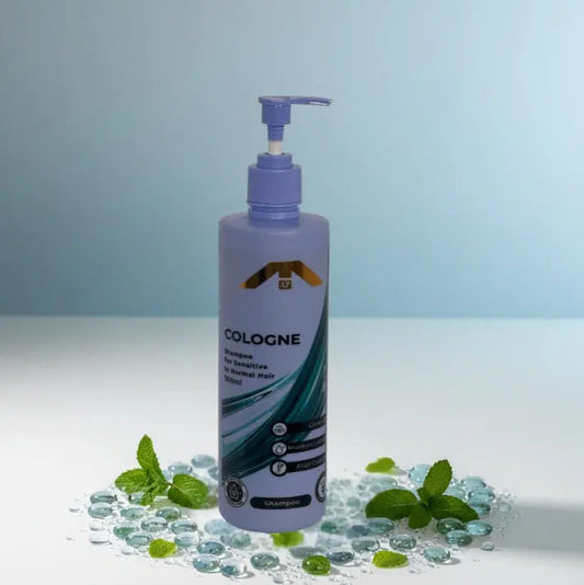 “All People Cologne Shampoo bottle with pump, placed on clear aqua gel beads with mint leaves on a soft blue and white background.”